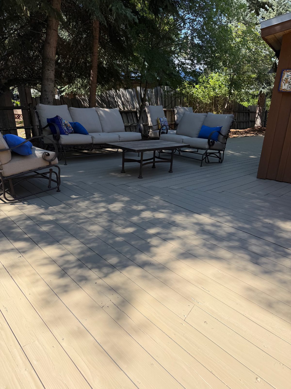 Finished residential deck after surface restoration and refinishing